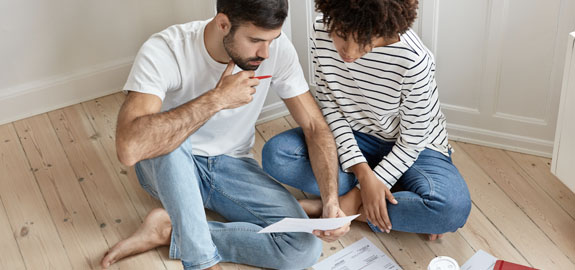 couple looks at papers