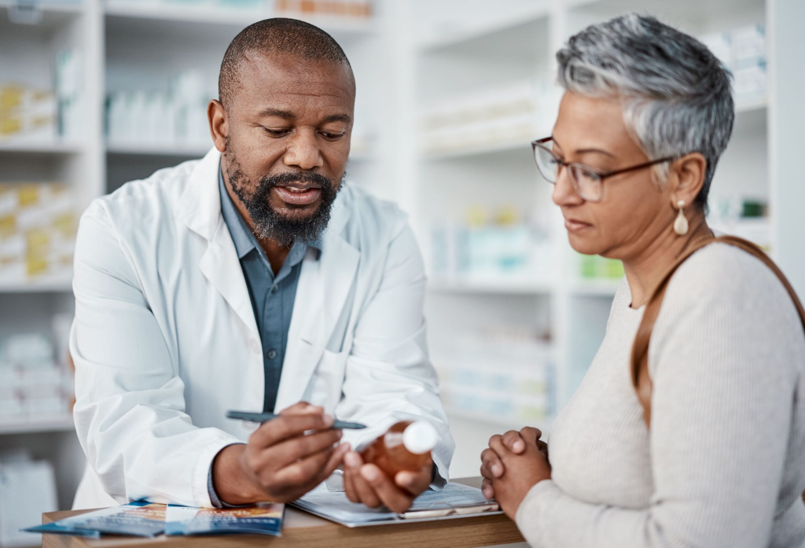 20355 pharmacist speaks with senior woman on medicare about her medication adobestock 560754118 resized